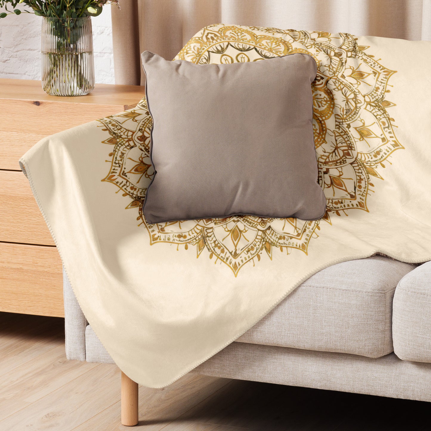 Large gold mandala on a plush sherpa blanket, soft, cozy blanket, shown in small size, on a couch